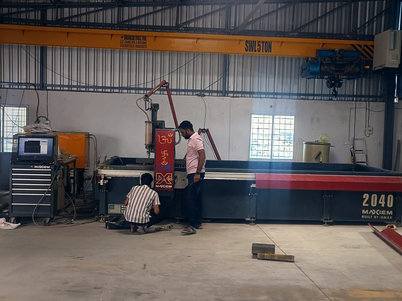 Team operating the MAXIEM 2040 abrasive waterjet